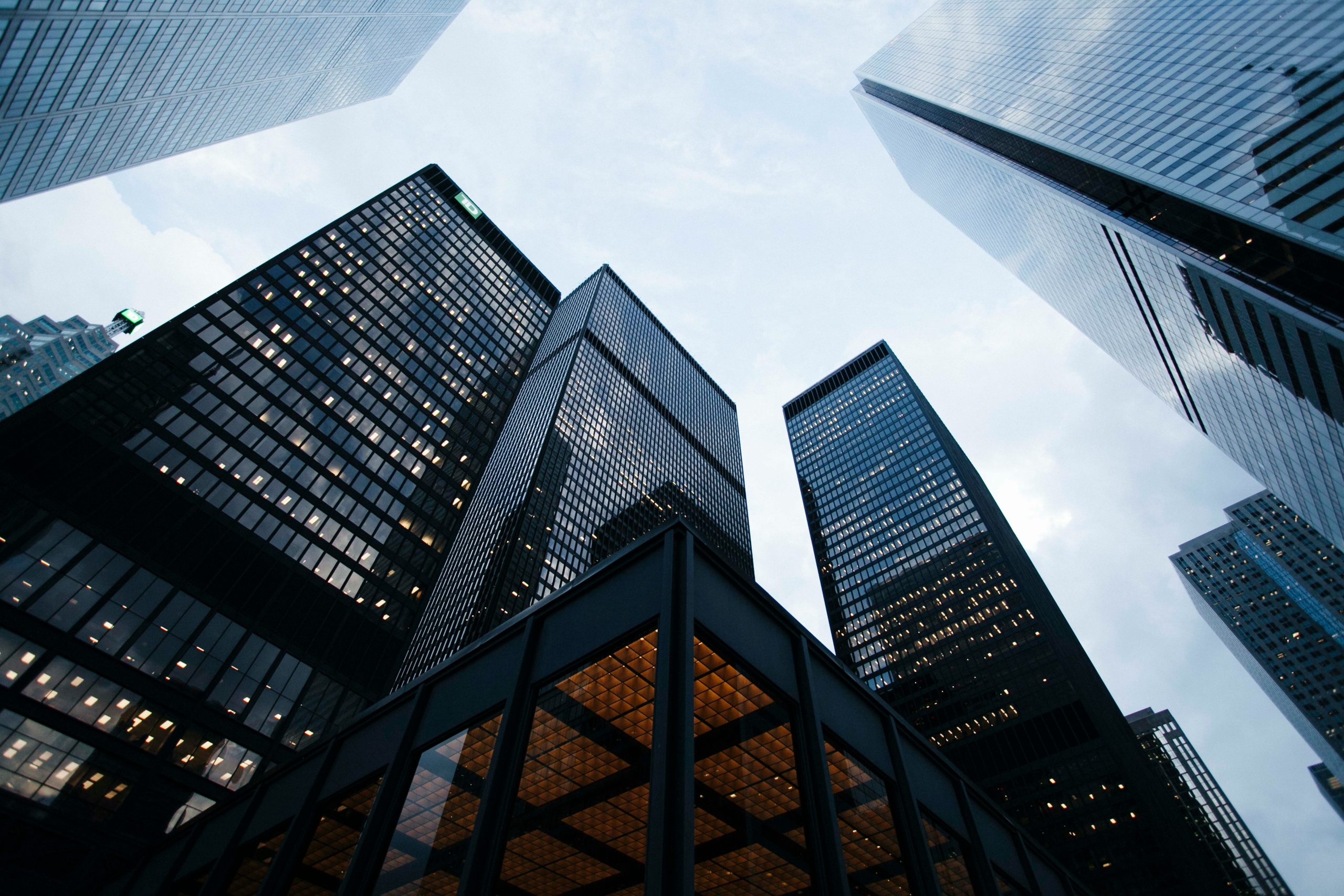 Upward view of tall glass skyscrapers in Philadelphia reflecting the sky